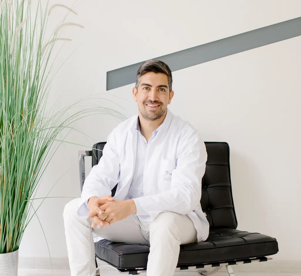 Dr Sebastian Podlipnik, seated in his consulting room
